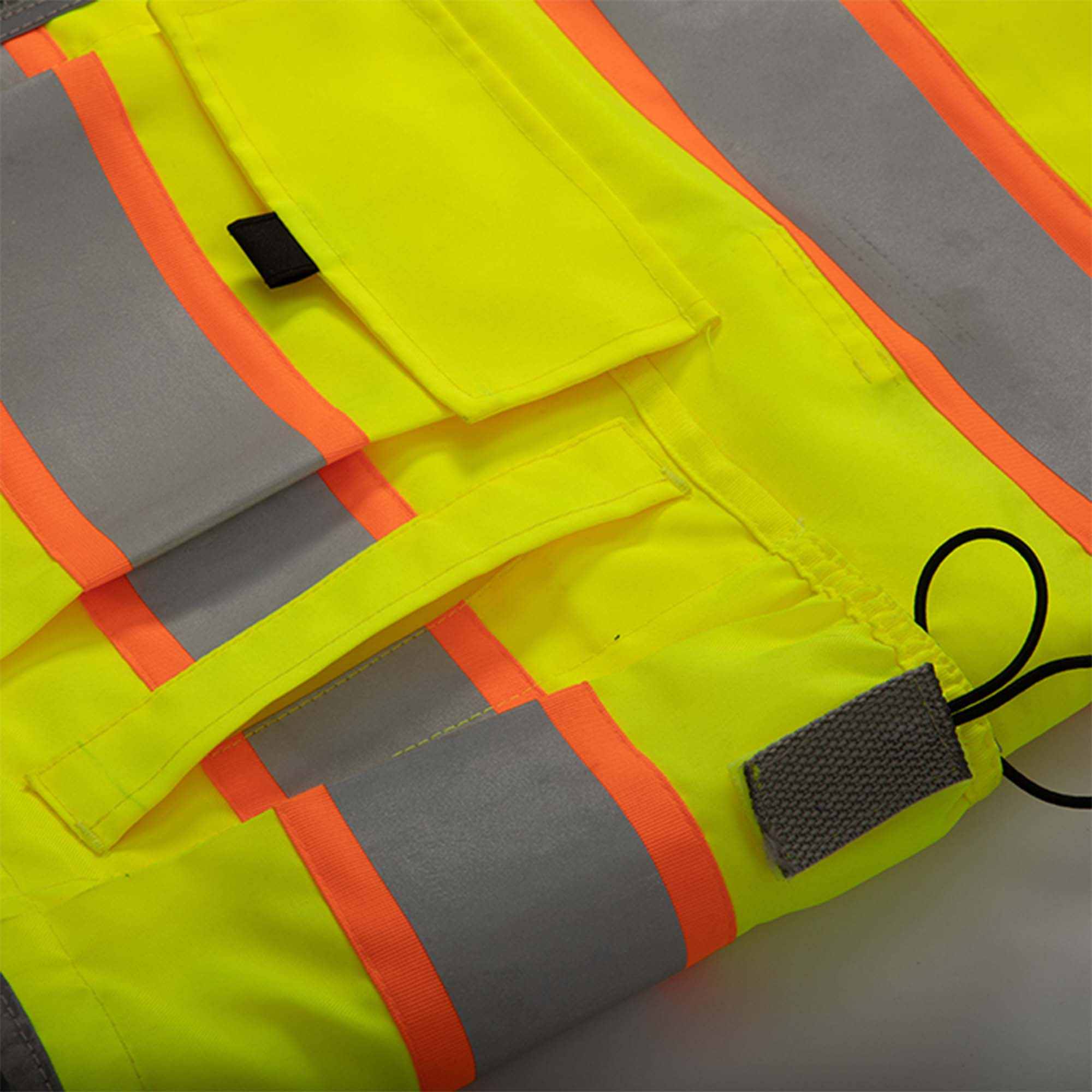 Class 3 surveyor vest with reflective stripes and multiple pockets.